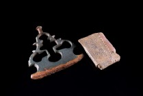 Lot of two Roman Artefacts, including a Bronze Handle (5x4.8cm) and a Flint with decorated Lead Sheath (3.3cm).