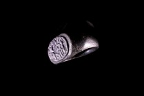 Late Roman Bronze Ring, c. 4th-5th century AD (2,5cm). Engraved with figure on horse stepping left, flanked by two standing figures. Intact, perfect c...