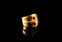 Late Roman - Byzantine double-band Gold Ring with two Ringstones of Garnet, decorated with globular projections, c. 4th-6th century AD (1.7cm). Intact...