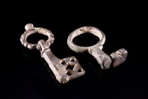 Roman and Byzantine. Lot of bronzes. The first is a Roman Finger Key Ring, c. 2nd-4th century AD (4cm), and the second is a Byzantine Key, c. 6th-12th...
