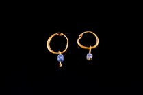 Pair of Byzantine Gold Earrings with blue stone pendants, c. 6th-8th century AD (11x17mm). Good condition.
