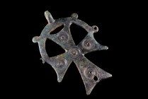 Byzantine large Bronze Cross Pendant, c. 7th-10th century AD (12cm). Concentric-circle decoration, sunspension loop, holed at the base. Green patina.