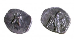 YEHUD, 4th CENTURY BCE Silver hemi-obol, 0.26 gr. Obverse: Head of Persian king to r. Reverse: Falcon hovering. Paleo-Hebrew inscription: yhd "Yehud"....