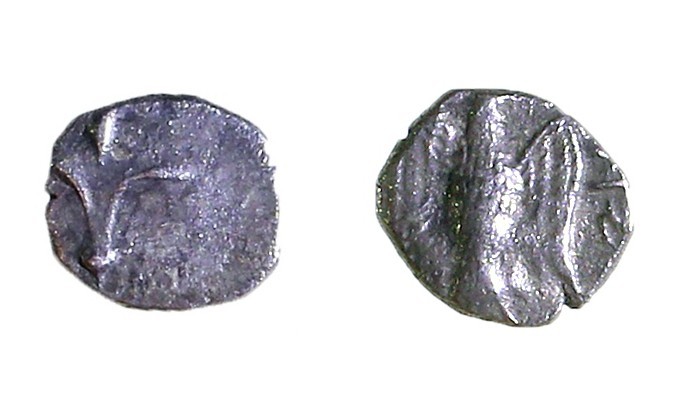 YEHUD, 4th CENTURY BCE Silver hemi-obol, 0.34 gr. Obverse: Lily. Reverse: Falcon...
