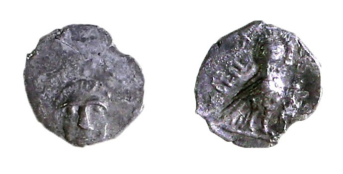 YEHUD UNDER PERSIAN RULE 4th cent. BCE Silver hemiobol, 0.22 gr. Obverse: Facing...