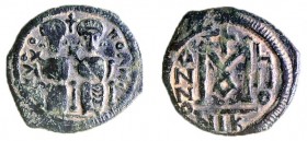 A BRONZE COIN OF SCYTHOPOLIS (BEIT-SHEAN), IN THE STYLE OF JUSTIN II, Post 641 CE. Obverse: Justin and Sophia enthroned. Greek inscription "Scythopoli...