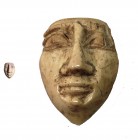 AN IVORY FEMALE MASK INLAY Late Bronze Age, 14th century BCE. 2.2 cm high. In good condition. Ex Shlomo Moussaieff collection, Herzliya Pituah.