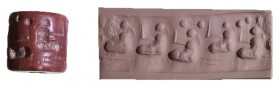 A BROWN STONE CYLINDER SEAL Jemdet Nasr Period, 3100 – 2900 BCE. Depicting five drilled and carved seated figures. In very good condition.