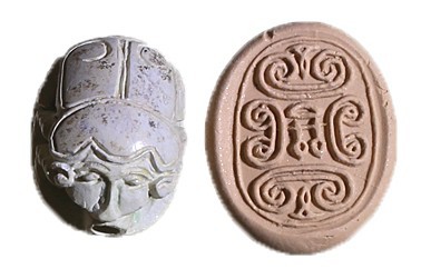 A WHITE STONE SCARAB SEAL 13th century BCE. 15.8x11.7x7.7 mm. Lengthwise perfora...