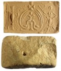 A CRUSADER STONE SEAL Ca. 10th-11th century CE. 6.4x3.8 cm. Depicting an inverted heart with a lily, topped by a cross and flanked by a saint and a pi...