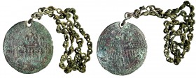 A CHRISTIAN GNOSTIC BRONZE AMULET Byzantine Period, 6th-7th century CE. 5.2 cm in diameter. Depicting a Saint riding a horse and spearing a demon, wit...