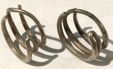 A PAIR OF ASSYRIAN SILVER HAIR GRIPS 8th century BCE. 25.6 gr., 2.8 cm in diameter. In very good condition and very rare. For similar items see: Ezio ...