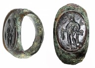 A ROMAN BRONZE RING 1st-2nd century CE. Depicting Hermes holding caduceus and pouch. With very nice dark brown patina and in very good condition. The ...