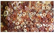 A LOT OF CANAANITE CARNELIAN, CRYSTAL AND SHELL BEADS Early Bronze – Iron Age, 3rd-1st millennium BCE. 91 gr. Ex Miriam Shamai collection, Zahala.