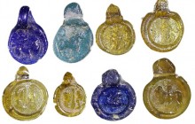 A LOT OF 8 IMPRESSED GLASS PENDANTS Byzantine Period, 4th-6th century CE. In very good condition. Ex Jacob Levi collection, Tel Aviv.