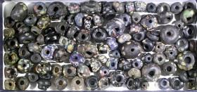 A LOT OF 98 BLACK GLASS BEADS DECORATED WITH MULTICOLORED DOTS Islamic Period, 6th-12th century CE. In very good condition. Ex Jacob Levi collection, ...