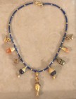 A LAPIS LAZULI AND GOLD MINIATURIC BEADS NECKLACE WITH 9 GOLD AND STONE PENDANTS Hellenistic Period, 4th-2nd century BCE. 39.5 cm long. In very good c...