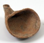 A TERRACOTTA OIL LAMP Iron Age I, ca. 1000 BCE. 15.1 cm. In very good condition and rare. Ex Aka Mizrahi collection, Tiberias.