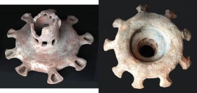 A UNIQUE HERODIAN TERRACOTTA OIL LAMP WITH 9 NOZZLES AND WITH A FENESTRATED TOWER IN THE CENTER 1st century CE. 25 cm in diameter, 11 cm high. 4 nozzl...