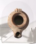 A TERRACOTTA OIL LAMP Herodian Period, 1st century BCE-CE. 8 cm. With high rim around the filling hole. In very good condition. Ex Judge Steve Adler c...