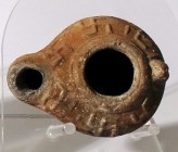 A ROMAN TERRACOTTA OIL LAMP 2nd-3rd century CE. 7.8 cm. Decorated with a 6 swastikas. In very good condition. Ex Judge Steve Adler collection, Jerusal...