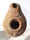A SAMARITAN TERRACOTTA OIL LAMP 4th century CE. 8.8 cm. Depicting the Greek inscription: EIC ΘEOC, and decorated with palm branches. In very good cond...