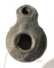 A SAMARITAN TERRACOTTA OIL LAMP 4th century CE. 9.3 cm. Decorated with weapons: Shield, sword, scabbard, pedum stick and axe. In very good condition. ...