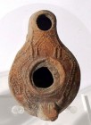 A SAMARITAN TERRACOTTA OIL LAMP 4th century CE. 8.5 cm. Decorated with a temple and stairs leading to it. In very good condition. Ex Judge Steve Adler...