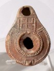 A SAMARITAN TERRACOTTA OIL LAMP 4th century CE. 7.6 cm. Decorated with a swastika. In very good condition. Ex Judge Steve Adler collection, Jerusalem ...