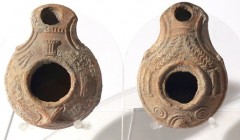 2 SAMARITAN TERRACOTTA OIL LAMPS 4th century CE. One decorated with a basket and bundles of plants, and the second with a temple. In good condition. E...