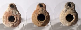 3 SAMARITAN TERRACOTTA OIL LAMPS 4th century CE. Decorated with floral, geometric motifs and tools. In good condition. Ex Shlomo Moussaieff collection...