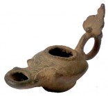 A ROMAN BRONZE OIL LAMP 3rd-4th century CE. 9.9 cm. Decorated with a plant and a leaf. With very nice patina and in very good condition. Ex Yoav Sasso...