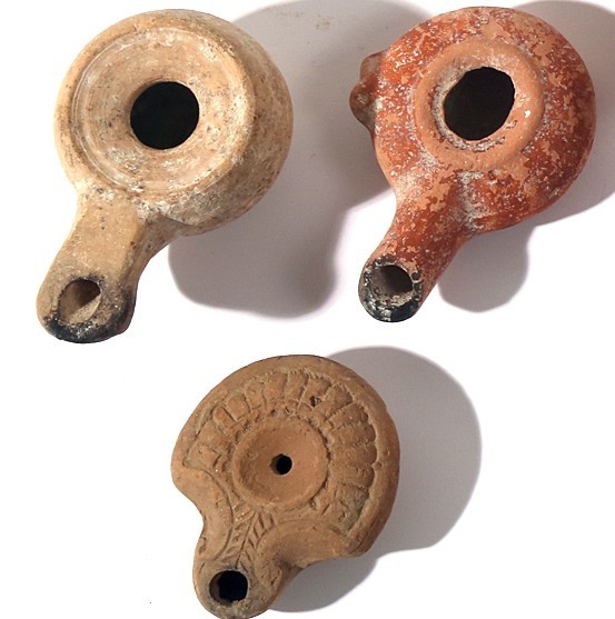 A LOT OF 3 TERRACOTTA OIL LAMPS Hellenistic Period, 3rd-1st century BCE. 9.4, 9....