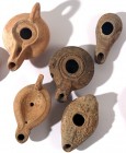 A LOT OF 5 TERRACOTTA OIL LAMPS Hellenistic and Roman Period, 2nd century BCE – 4th century CE. In very good condition (one handle damaged). Ex Yoav S...