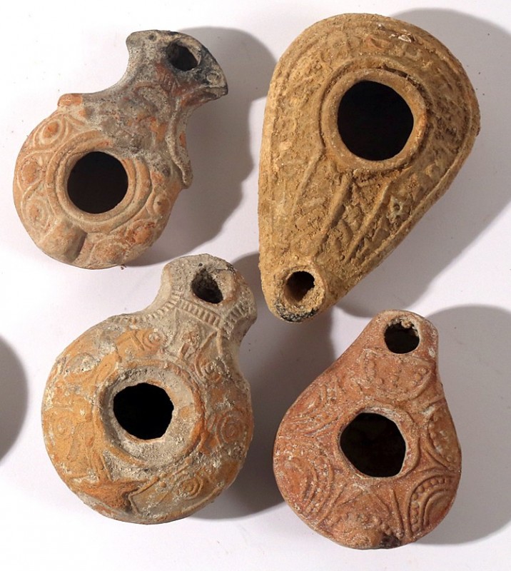 A LOT OF 4 TERRACOTTA OIL LAMPS One Roman, one Samaritan and 2 Byzantine, 2nd - ...