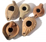 A LOT OF 5 TERRACOTTA OIL LAMPS One Hellenistic, 2 Byzantine and 2 Islamic, 2nd century BCE - 8th century CE. In very good condition. Ex Miriam Shamai...
