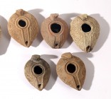 A LOT OF 4 MINI TERRACOTTA OIL LAMPS Early Islamic Period, 7th-8th century CE. Decorated with geometric and floral motifs. In very good condition. Ex ...