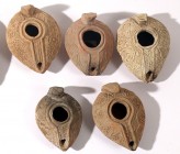A LOT OF 5 TERRACOTTA OIL LAMPS Early Islamic Period, 7th-8th century CE. Decorated with geometric and floral motifs. In very good condition. Ex Miria...