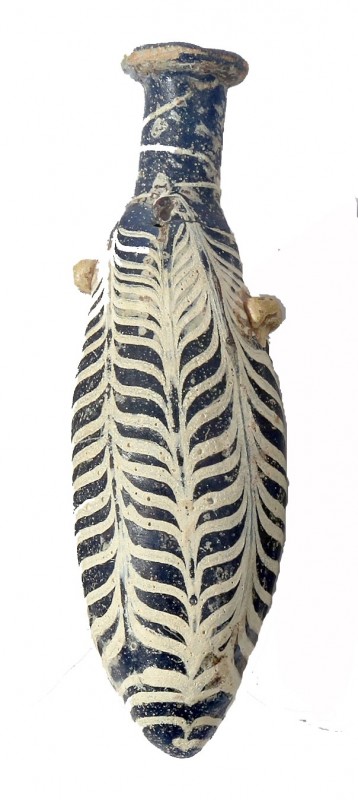 A SAND-CORE BLUE GLASS ALABASTRON WITH WHITE PLUME DECORATION Hellenistic Period...