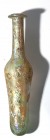 A GLASS TEST-TUBE LIKE VESSEL Roman Period, 3rd-4th century CE. 16.4 cm high. With very nice patina and in very good condition (mini tension crack at ...