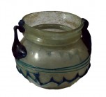 A TRANSLUCENT GLASS JAR WITH DARK GREEN HANDLES AND DECORATION Byzantine Period, 4th-5th century CE. 9.4 cm in diameter and 7.7 cm high. In very good ...