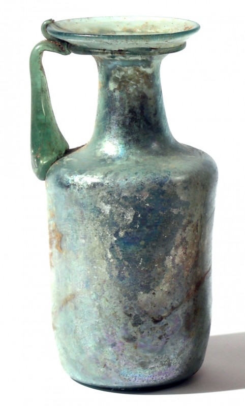 A CYLINDRICAL GLASS BOTTLE Late Roman Period, 4th century CE. 16.8 cm high. With...