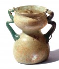 A TRANSLUCENT GLASS JAR WITH A "DOUBLE" BODY AND HANDLES Byzantine Period, 4th-5th century CE. 11.8 high. With nice patina and in very good condition....