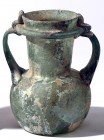 A GREENISH GLASS JAR WITH 2 HANDLES Byzantine Period, 4th-5th century CE. 13.8 cm high. With a small crack under the rim but in very good condition. E...