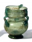 A TRANSLUCENT GLASS JAR, 3 HANDLES Byzantine Period, 4th-5th century CE. 7.8 cm high. In very good condition. Ex David Bergman collection, Haifa.