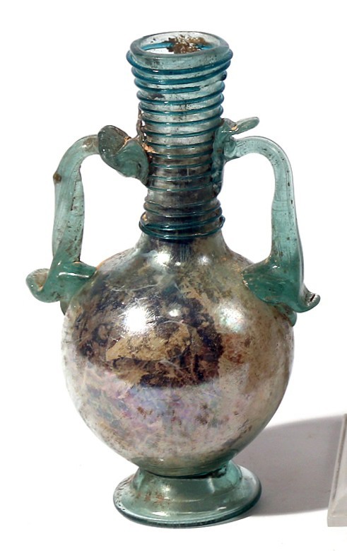 A LIGHT GREEN GLASS AMPHORA Byzantine Period, 5th-6th century CE. 13.7 cm high. ...