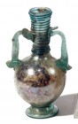 A LIGHT GREEN GLASS AMPHORA Byzantine Period, 5th-6th century CE. 13.7 cm high. With nice internal silver patina and in very good condition. Ex Yoav S...