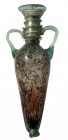 A LIGHT GREEN GLASS AMPHORA Byzantine Period, 5th-6th century CE. 16.5 cm high. In very good condition. Ex Yoav Sasson collection, Jerusalem.