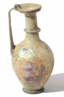 A TRANSLUCENT GLASS JUGLET Byzantine Period, 4th-5th century CE. 15.3 cm high. With some nice patina. In very good condition. Ex David Bergman collect...