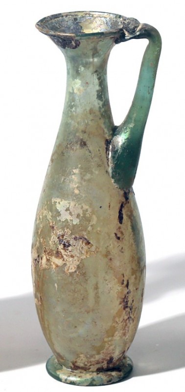 A TRANSLUCENT GLASS JUGLET Byzantine Period, 4th-5th century CE. 15.6 cm high. W...